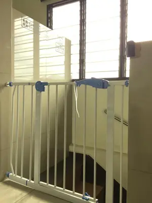 a gate in a room with a window at Buntong Homestay -Rooms Only in Ipoh