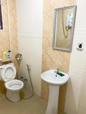 a bathroom with a toilet and a sink at Buntong Homestay -Rooms Only in Ipoh