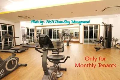 a gym with several treadmills and a treadmill at H2H - Euro House @ Majestic Ipoh (8~10 Guests) in Ipoh