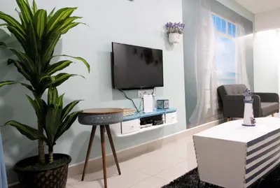 a living room with a tv and a plant at H2H - Marine Home @ Majestic Ipoh (8~10 Guests) in Ipoh