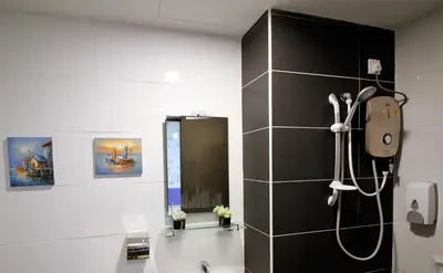 a bathroom with a shower and a mirror at H2H - Marine Home @ Majestic Ipoh (8~10 Guests) in Ipoh