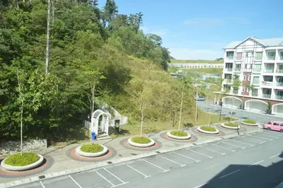 an overhead view of a street with trees and buildings at My 4Rooms Apartment @ Golden Hills Pasar Malam in Cameron Highlands
