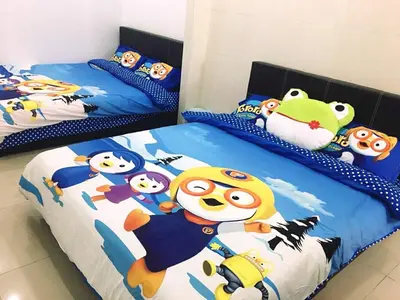 two beds with hello kitty and pikachu characters on them at W9 atGoldenHills NightMarket WiFi 4R BBQ in Cameron Highlands