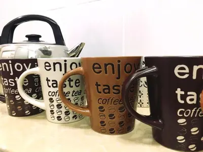 a row of coffee mugs sitting on a counter at W9 atGoldenHills NightMarket WiFi 4R BBQ in Cameron Highlands