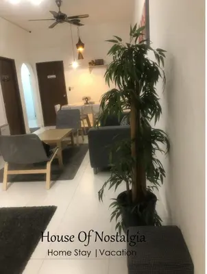 a living room with a house of mosikita home stay vacation at House Of Nostalgia in Lumut