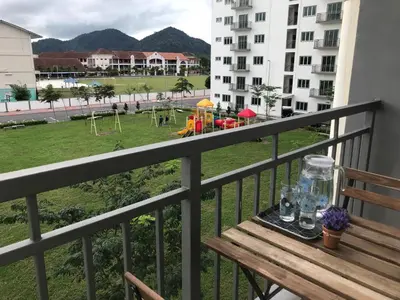 a balcony with a bench and a playground at House Of Nostalgia in Lumut