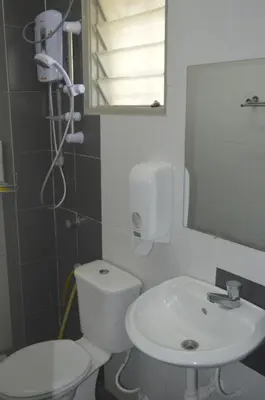 a bathroom with a white toilet and a sink at My Home N2 @ Golden Hills Night Market in Cameron Highlands