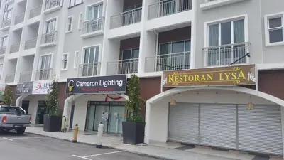 a white building with a rishioman kaya sign on it at My Home N2 @ Golden Hills Night Market in Cameron Highlands