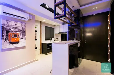a kitchen with an orange train on the wall at JOMSTAY Majestic Premier Suites Ipoh Town in Ipoh