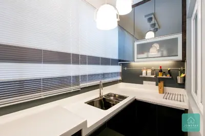 a kitchen with a sink and a window at JOMSTAY Majestic Premier Suites Ipoh Town in Ipoh