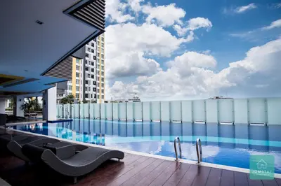 a swimming pool on the roof of a building at JOMSTAY Majestic Premier Suites Ipoh Town in Ipoh