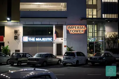 a group of cars parked in front of a building at JOMSTAY Majestic Premier Suites Ipoh Town in Ipoh