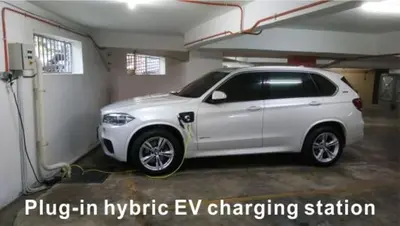a white car is parked in a garage at Asiago Hotel in Sungai Petani