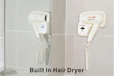 two phones are attached to a wall in a bathroom at Asiago Hotel in Sungai Petani