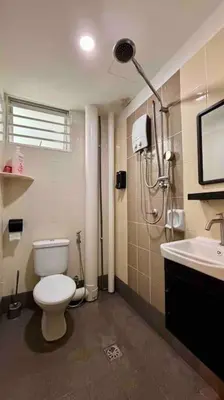 a bathroom with a toilet and a shower and a sink at Moderm Spacious 6pax S PICE Penang in Bayan Lepas