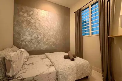 a bedroom with a bed with a teddy bear on it at Moderm Spacious 6pax S PICE Penang in Bayan Lepas