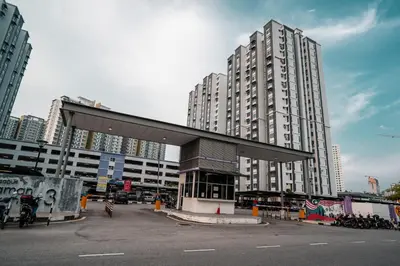 a large building with a long roof in a city at Moderm Spacious 6pax S PICE Penang in Bayan Lepas