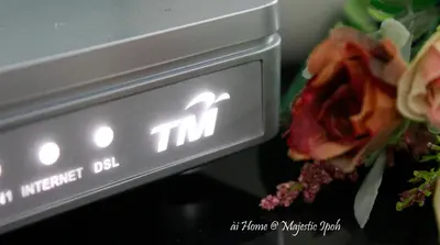 a clock with the time on it next to flowers at H2H - London House @ Majestic Ipoh (8~10 Guests) in Ipoh