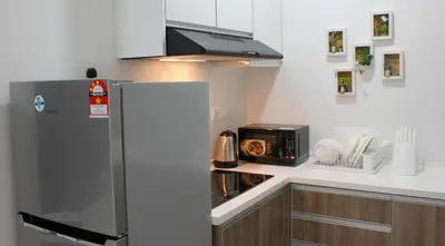a kitchen with a refrigerator and a microwave at H2H - London House @ Majestic Ipoh (8~10 Guests) in Ipoh