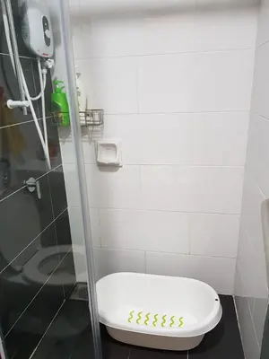 a bathroom with a toilet and a shower stall at Nordiska @ Majestic Ipoh in Ipoh