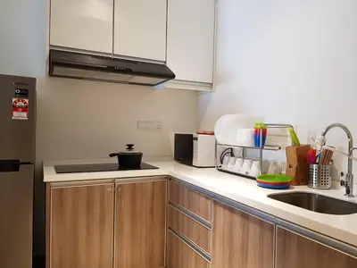 a kitchen with a sink and a microwave at Nordiska @ Majestic Ipoh in Ipoh