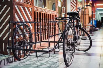 a bike parked on a rack in a building at Wan Alyasa Hotel in Cameron Highlands