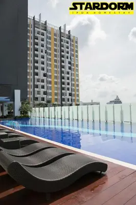 a hotel swimming pool with a view of a building at Ipoh City Center Stardorm 2 Ipoh Homestay in Ipoh