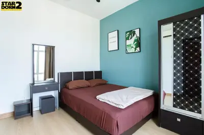 a bedroom with a bed and a blue wall at Ipoh City Center Stardorm 2 Ipoh Homestay in Ipoh