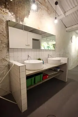 a bathroom with two sinks and a mirror at Stay SongSong Beach Street in George Town