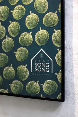a framed picture of a song sung koke pear cluster at Stay SongSong Beach Street in George Town