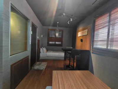 a room with a room with a bed and a table at SECRET STUDIO On Factory in George Town