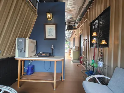 a room with a table with a computer on it at SECRET STUDIO On Factory in George Town