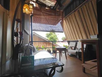 a room with a bed and a large window at SECRET STUDIO On Factory in George Town