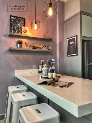 a bathroom with a counter with a toilet and a sink at Le Maison GuestHouse Ipoh @ Octagon in Ipoh