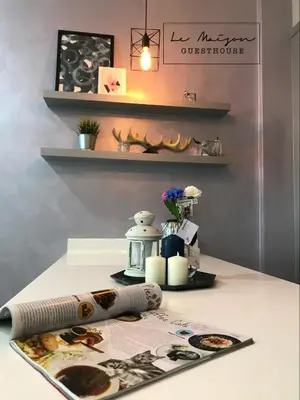a table with a baseball bat on top of it at Le Maison GuestHouse Ipoh @ Octagon in Ipoh