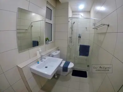 a bathroom with a sink and a shower and a toilet at Le Maison GuestHouse Ipoh @ Octagon in Ipoh
