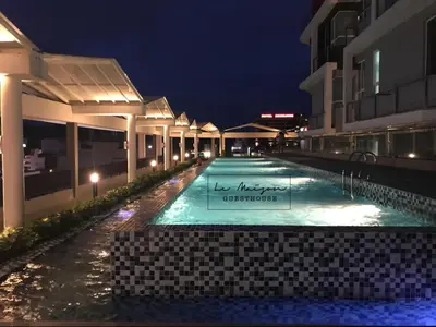 a swimming pool in the middle of a building at night at Le Maison GuestHouse Ipoh @ Octagon in Ipoh
