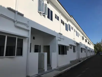 a white building with windows on the side of it at My STW Home 2 in Sitiawan