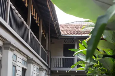 an external view of a building with a balcony at Muntri Mews in George Town