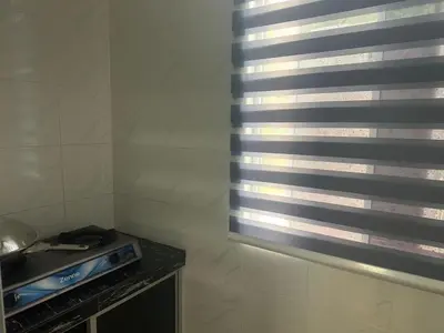 a room with a window and a stove in a kitchen at Ar Rayyan Apartments Prima Villa 3D8 in Cameron Highlands