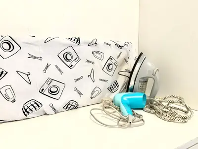 a phone and a bag with pictures on it at Themework Homestay@Cameron Highlands in Cameron Highlands