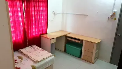 a small room with a desk and a table at Homestay Ahmad Kuala Kangsar in Kuala Kangsar