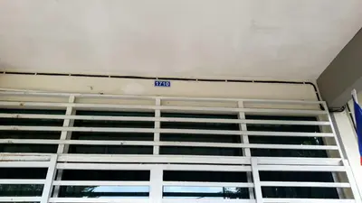 a view of a building with a sign on it at Homestay Ahmad Kuala Kangsar in Kuala Kangsar