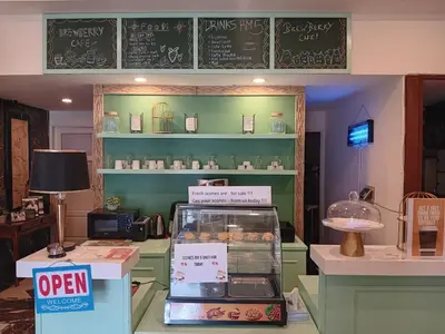 a shop with a display of pastries on shelves at Melur Inn in Cameron Highlands
