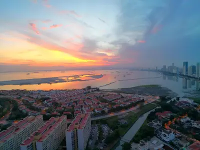 an aerial view of a city at sunset at The Landmark Pulau Andaman Gurney Bay View in George Town