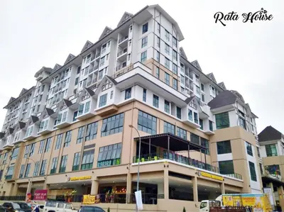a large apartment building with a lot of windows at Rata House in Cameron Highlands
