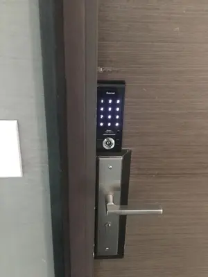 an open door with a cell phone in it at Urbano Luxury Maritime Suite in George Town