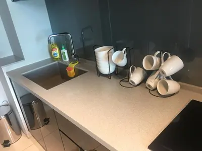 a counter with cups and other items on it at Urbano Luxury Maritime Suite in George Town