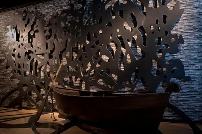 a wooden bowl with a piece of metal on it at Big Banana Hotel, Sg Petani in Sungai Petani