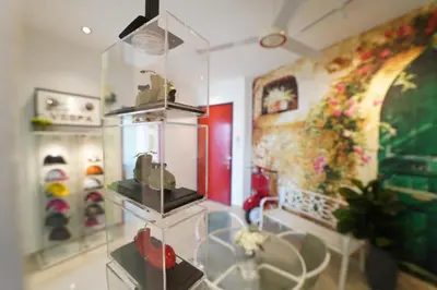 a room with a display case with shoes in it at \u5bb6 Majestic Ipoh in Ipoh